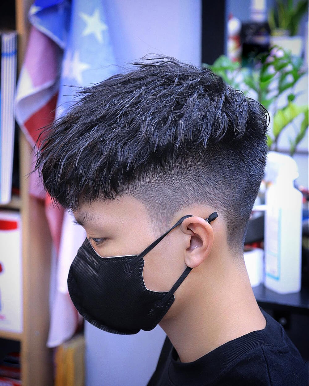 Rat tail hairstyle, a cropped or shaved head with a small long grown  section of hair at the back