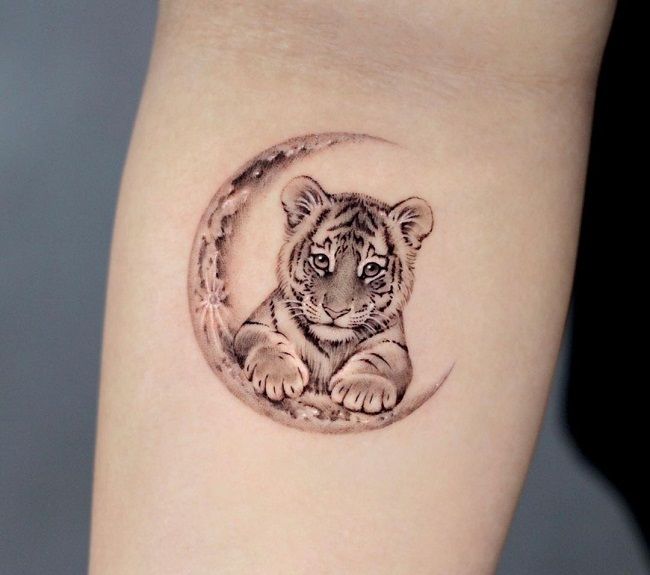 Adikt Ink Tattoo Studios - MINIMALISTIC TATTOO Baby Tiger Tattoo Done by  our artist 👉🏻 Arm At Adikt Ink 🇱🇺 Don't forget we're open Today! Do not  hesitate to step by