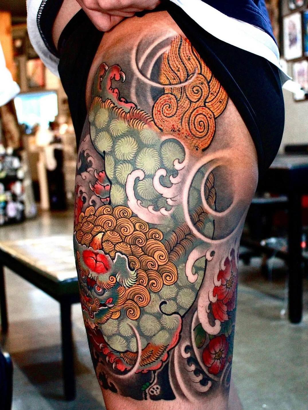 Japanese toad tattoo located on the calf.